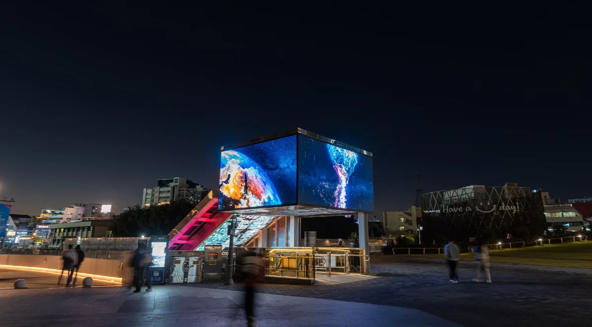 Outdoor LED screen in a public plaza at night