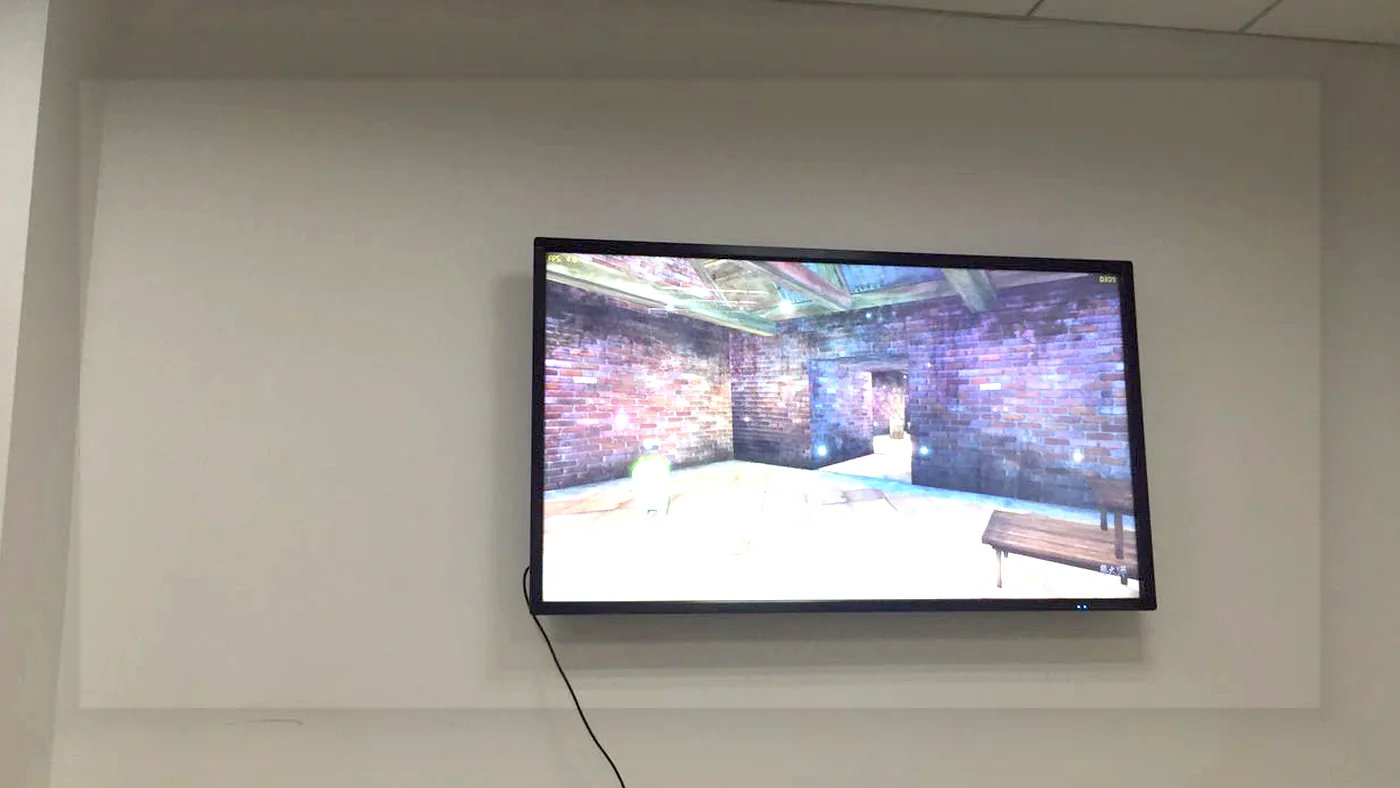 Wall-mounted commercial LCD display installed in a meeting room